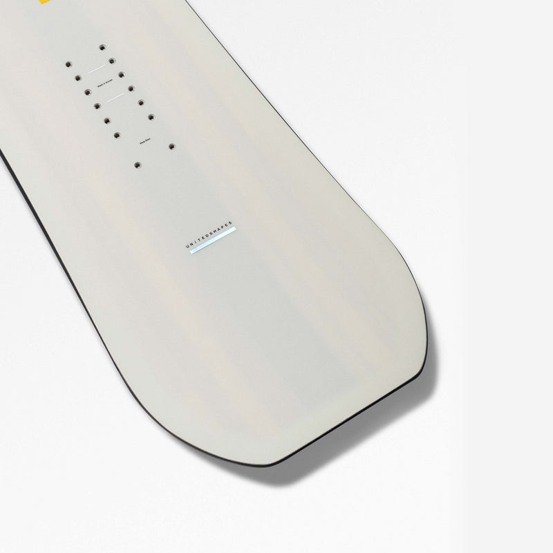 Nose close-up shot of white and yellow freeride and all-mountain snowboard Horizon by United Shapes