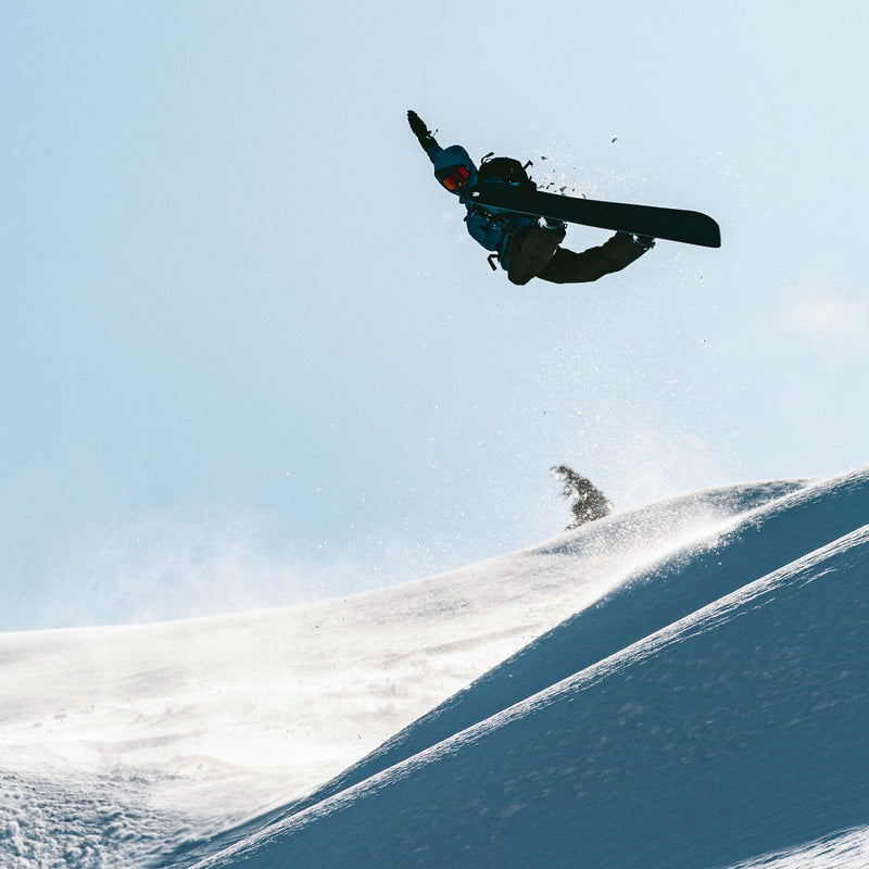 Snowboarder riding through ice on the freeride board Cadet by United Shapes