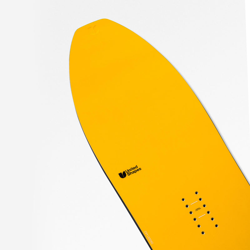 Nose close-up shot of yellow powder snowboard Experiment by United Shapes 
