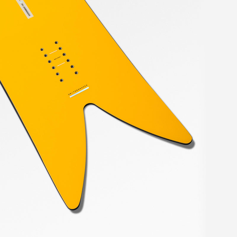 Fish tail close-up shot of yellow powder snowboard Experiment by United Shapes 
