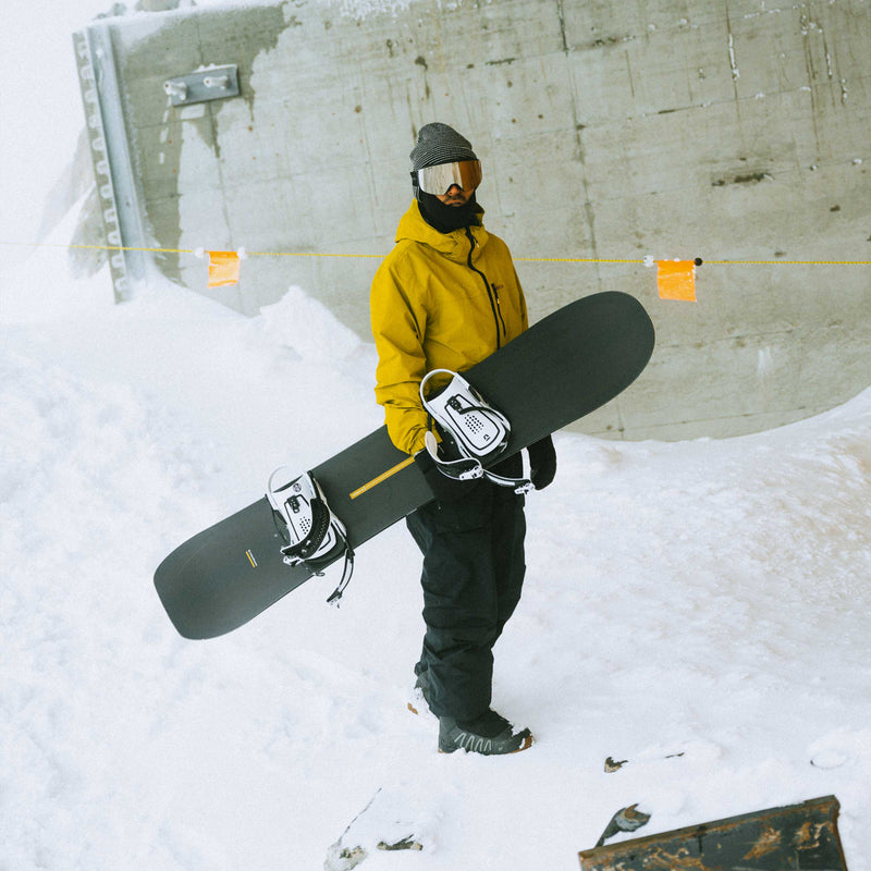 Snowboarder with the all-mountain Horizon snowboard by United Shapes