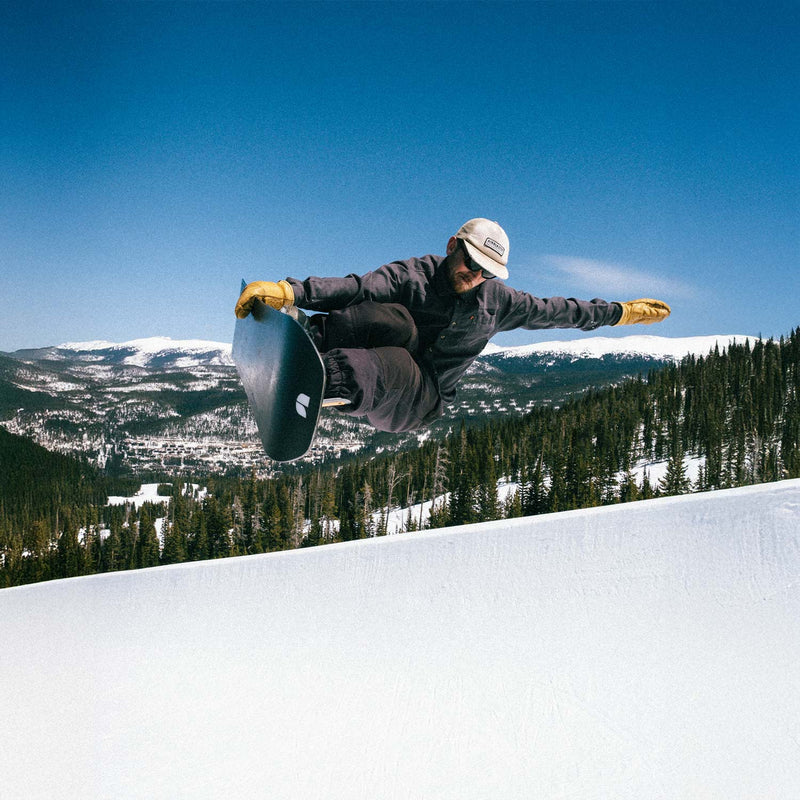 Freestyle snowboarders having fun jumping with Object by United Shapes